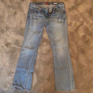 A pair of light blue jeans, lightly used